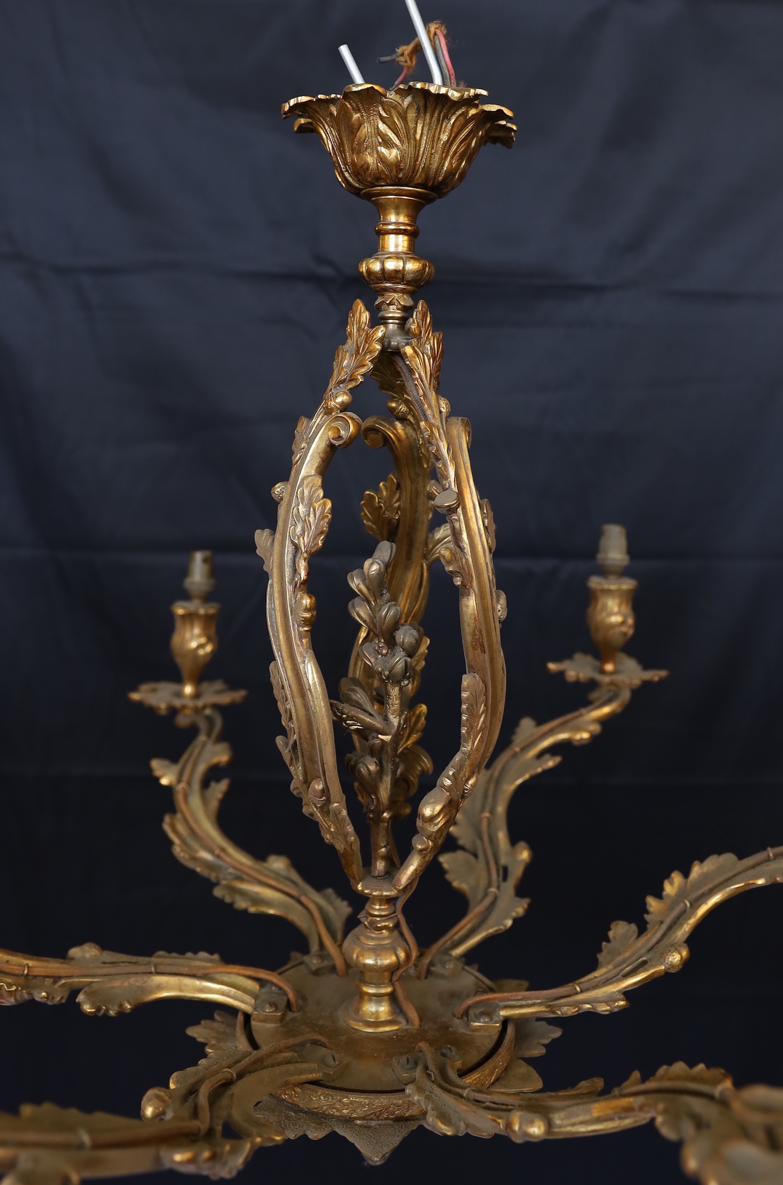 An early 20th century French gilt bronze rococo six light chandelier, height 59cm. width 66cm